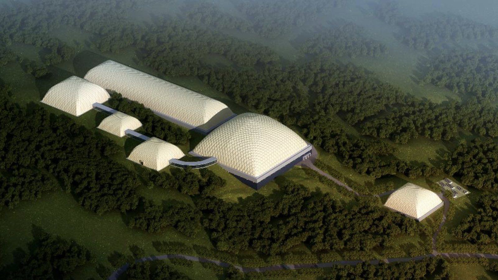 Multiple domes following sloping forested terrain